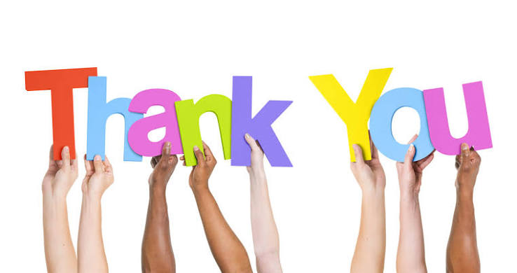 Diverse group of customers holding up colorful letters spelling Thank You